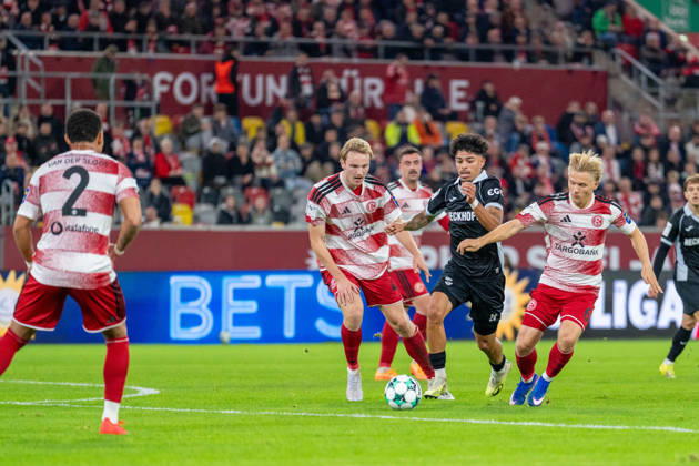 Lukas Bornschein, Fortuna Düsseldorf, 04 and Andreas Mueller of Fortuna Düsseldorf, 06, in a tackle with Andre Leipold of SC Verl, 20. Fortuna Düsseldorf vs. SC Verl, soccer, 3rd Division, Matchday 8, 2026–27 season, October 12, 2026, DFL regulations prohibit any use of photographs as image sequences and or quasi-video. Fortuna Düsseldorf vs. SC Verl, soccer, 3rd Division, Matchday 8, 2026–27 season, October 12, 2026, Düsseldorf Copyright: xEibner-Pressefoto LukasxBaldygax EP_LBA
