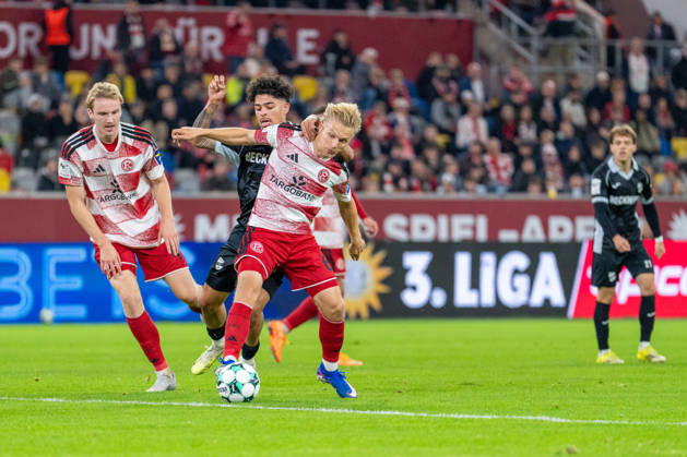 Lukas Bornschein, Fortuna Düsseldorf, 04 and Andreas Mueller of Fortuna Düsseldorf, 06, in a tackle with Andre Leipold of SC Verl, 20. Fortuna Düsseldorf vs. SC Verl, soccer, 3rd Division, Matchday 8, 2026–27 season, October 12, 2026, DFL regulations prohibit any use of photographs as image sequences and or quasi-video. Fortuna Düsseldorf vs. SC Verl, soccer, 3rd Division, Matchday 8, 2026–27 season, October 12, 2026, Düsseldorf Copyright: xEibner-Pressefoto LukasxBaldygax EP_LBA