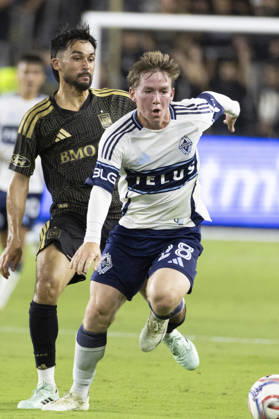 October 10, 2026, Los Angeles, California, USA: Vancouver Whitecaps left wing back Tate Johnson (28) and Los Angeles FC defensive midfielder Mathieu Choiniere (66) in actions during a MLS, Fussball Herren, USA soccer game on Saturday, Oct. 10, 2026 in Los Angeles. Los Angeles USA - ZUMAc68_ 20261010_zaf_c68_088 Copyright: xRingoxChiux