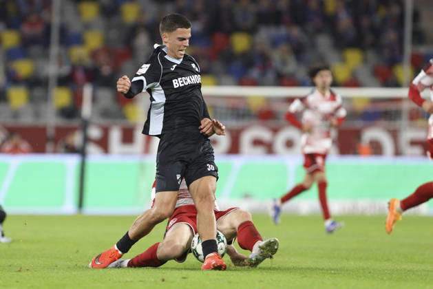 Almin Mesanovic of SC Verl and Lukas Bornschein of Fortuna Düsseldorf battle for the ball during the 3. Liga match between Fortuna Düsseldorf and SC Verl at the Merkur Spiel Arena on October 11, 2026, in Düsseldorf, Germany. Photo by Oliver Kaelke, DeFodi Images. Almin Mesanovic of SC Verl and Lukas Bornschein of Fortuna Düsseldorf battle for the ball during the 3. Liga match between Fortuna Düsseldorf and SC Verl at Merkur Spiel Arena on October 11, 2026 in Düsseldorf, Germany. Photo by Oliver Kaelke, DeFodi Images. DFB and DFL regulations prohibit any use of photographs as image sequences and or quasi-video. Photo by Oliver Kaelke, DeFodi Images.