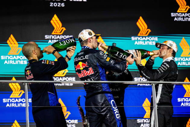 F1 - SINGAPORE GRAND PRIX 2026 LAMBIASE Gianpiero, Head of Race Engineering at Red Bull Racing, portrait, VERSTAPPEN Max (nld), Red Bull Racing Ford RB22, portrait LECLERC Charles (mco), Scuderia Ferrari SF-26, portrait Moet Chandon podium during the 2026 Formula 1 Singapore Grand Prix, 17th round of the 2026 Formula One World Championship, WM, Weltmeisterschaft from October 9 to 11, 2026 on the Marina Bay Street Circuit, in Singapore, Singapore - SingaporeSingapore  Copyright: xALBERTOxVIMERCATIx