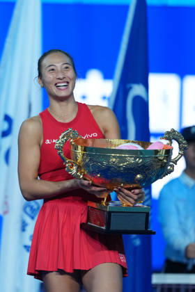 (261011) -- BEIJING, Oct. 11, 2026 -- Zheng Qinwen poses with the trophy during the awarding ceremony after the women s singles final between Zheng Qinwen of China and Mirra Andreeva of Russia at 2026 China Open tennis tournament in Beijing, China, Oct. 11, 2026. ) (SP)CHINA-BEIJING-TENNIS-CHINA OPEN-WOMEN S SINGLES-FINAL (CN) SunxFei