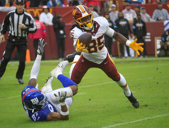 October 11, 2026: Washington Commanders TE 85 Chigoziem Okonkwo is unable to come down with a one handed grab during the Washington Commanders game against the New York Giants at Northwest Stadium in Landover, MD. CSM Landover United States of America - ZUMAc04_ 20261011_zma_c04_108 Copyright: xJustinxCooperx