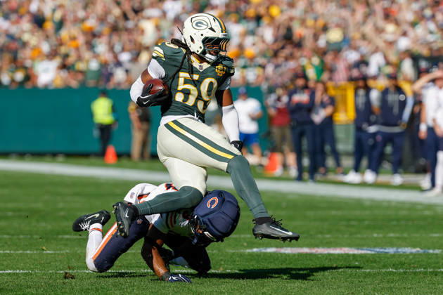Oct 11, 2026; Green Bay, WI, USA; Green Bay Packers linebacker Ty ron Hopper (59) is tackled after making a interception during NFL, American Football Herren, USA game action against the Chicago Bears at Lambeau Field. Mandatory Credit: -Cal Media NFL 2026: Bears Vs Packers OCT 11 - ZUMAc04_ 20261011_zma_c04_231 Copyright: xDarrenxLeex