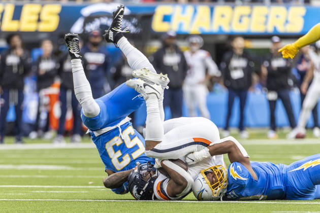 October 11, 2026, Inglewood, California, USA: Denver Broncos Running Back J.K. Dobbins (27) is brought down by Los Angeles Chargers linebacker sDel Shawn Phillips (53) and Daiyan Henley (0) during an NFL, American Football Herren, USA football game, in Inglewood, Calif. on Sunday Oct. 11, 2026. Inglewood USA - ZUMAc68_ 20261011_zaf_c68_027 Copyright: xRingoxChiux