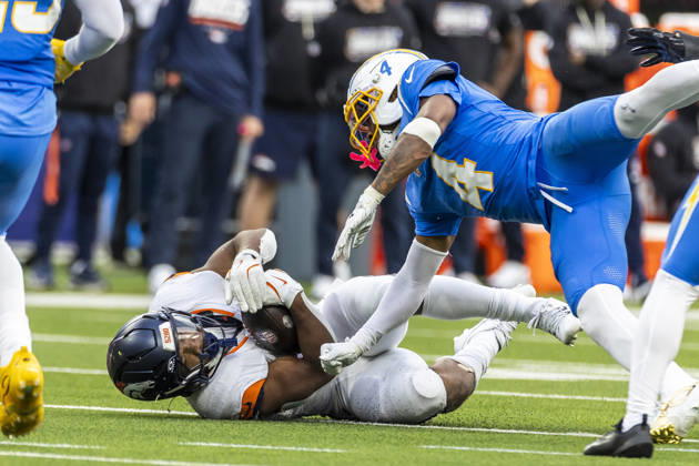 October 11, 2026, Inglewood, California, USA: Denver Broncos Running Back J.K. Dobbins (27) is tackled by Los Angeles Chargers cornerback Tarheeb Still (4) during an NFL, American Football Herren, USA football game, in Inglewood, Calif. on Sunday Oct. 11, 2026. Inglewood USA - ZUMAc68_ 20261011_zaf_c68_028 Copyright: xRingoxChiux