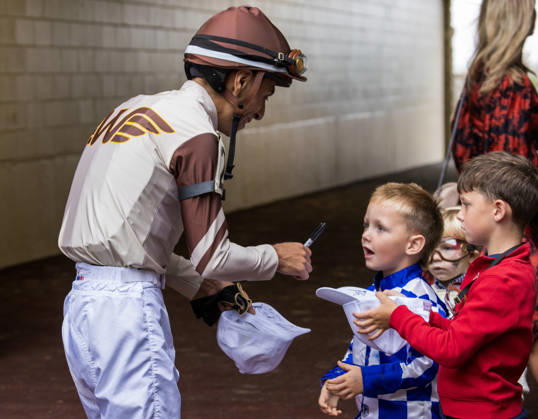 HORSE RACING 2026: Franklin Stakes Day Keeneland OCT 11 October 11, 2026, Lexington, Ky, USA: Jockey Emmanuel Esquivel with a group of young fans on Franklin Stakes Day on October 11, 2026. Candice Chavez Eclipse Sportswire CSM(Credit Image: Â {Serial Cal Media) Lexington Ky USA EDITORIAL USE ONLY Copyright: xx ZUMA-20261011_faf_cs17_025.jpg {Serialx csmphotothree533789