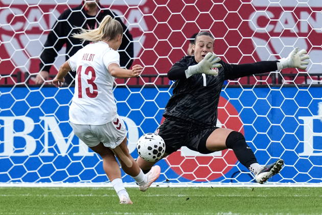 October 12, 2026, Toronto, On, CANADA: Denmark s Olivia Holdt places the ball past Canada goalkeeper Kailen Sheridan to score her country s third goal during first half International Friendly, Länderspiel, Nationalmannschaft action, in Toronto, on Monday Oct. 12, 2026. Canada News - October 12, 2026 - ZUMAc35_ 20261012_zaf_c35_057 Copyright: xChrisxYoungx