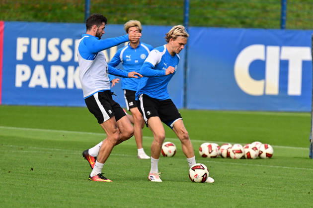 October 13, 2026, Soccer, Men s, 2nd Division Bundesliga, 2026–2027 Season, Holstein Kiel Practice, KSV Noah Madsen with the ball against Giorgi Kvilitaia in Kiel, near Holstein Stadium Projensdorf, Training Center, Northern Schleswig-Holstein, Germany