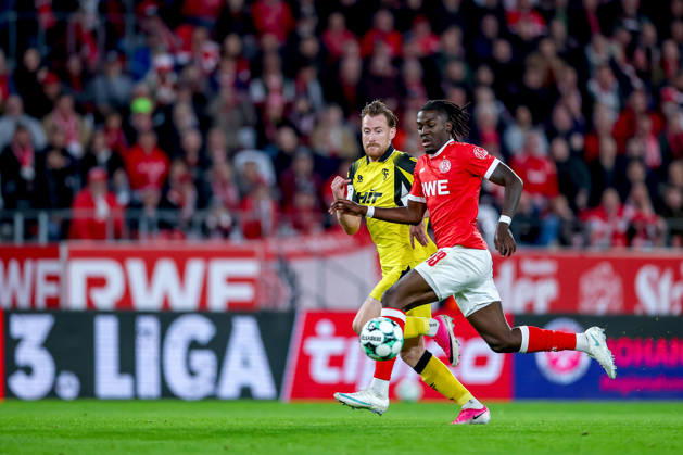 October 13, 2026, Soccer, 3rd Division, Rot Weiss Essen vs. SC Fortuna Köln, Hafenstraße Stadium, Matchday 9, 2026–27 Season: Franci Bouebari (RWE 19) in a tackle against Jannik Mause (SC Fortuna Köln 37). DFB regulations prohibit any use of photographs as image sequences and or quasi-video. North Rhine-Westphalia, Germany