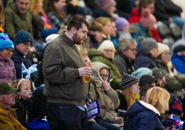 A fan carries a pint of lager in the stand. Alcohol is on sale at tonight s Scotland Women v Czechia match at The Marbill Coaches Stadium, Paisley, as a controlled trial between the Scottish football authorities and the Scottish Government. Scotland Women v Czechia, Women s European World Cup Qualifier, Football, The Marbill Coaches Stadium, Paisley, Scotland, UK - 13 Oct 2026Paisley The Marbill Coaches Stadium Scotland United Kingdom  Copyright: xStuartxWallace Shutterstockx 17214114aq