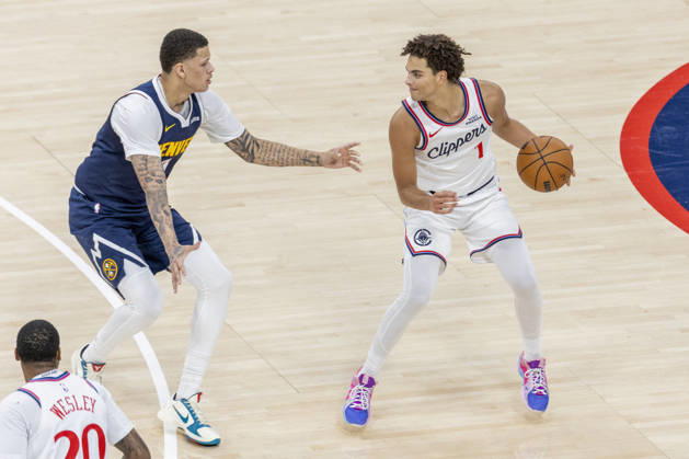 October 14, 2026, Inglewood, California, USA: Los Angeles Clippers Keaton Wagler (1) is defended by Denver Nuggets Trevon Brazile (7) during an NBA, Basketball Herren, USA preseason game on Wednesday, Oct. 14, 2026 in Inglewood Calf. NBA 2026: Clippers Vs Nuggets  - ZUMAc68_ 20261014_zaf_c68_044 Copyright: xRingoxChiux