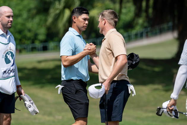 October 15, 2026, Coloane, Macao Sar, China: Hong KongÃ¢â‚¬â ¢s Matthew CHEUNG thanks.Nick VOKE from New Zealand on the 9th green for their round.Opening Round in the Macao Open Golf at Macau Golf & Country Club. Coloane China - ZUMAr144 20261015_zap_r144_161 Copyright: xJaynexRussellx