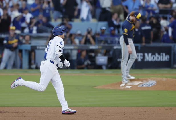 Los Angeles Dodgers designated hitter Shohei Ohtani (17) runs the bases past as Milwaukee Brewers pitcher Dustin May (21) after hitting a three-run home run in the second inning during game four of the MLB, Baseball Herren, USA National League Championship Series at Dodger Stadium in Los Angeles, California, on Thursday, October 15, 2026.  LAP20261015729 CAROLINExBREHMAN