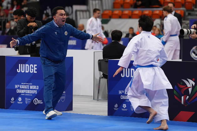 2026 World Cadet, Junior & U21, U 21 Karate Championships BIELSKO-BIALA, POLAND - OCTOBER 16: Javokhir Djakhangirov of Uzbekistan celebrates victory with his coach after winning the cadet male individual kata semi-final at the 2026 World Cadet, Junior & U21 Karate Championships at Hala Pod Debowcem on October 16, 2026 in Bielsko-Biala, Poland. Bielsko-Biala Hala Pod Debowcem Poland Copyright: x2026xKaratexInsights PSxImagesxMartinxKremser KaratexInsightsx
