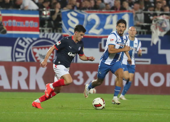 Guillermo Balzi, Holstein Kiel; Kevin Sessa, Hertha BSC Berlin; Soccer, Men s, 2026–2027 Season, 2. Bundesliga, Holstein Stadium, Holstein Kiel vs. Hertha BSC Berlin. DFL regulations prohibit any use of photographs as image sequences and or quasi-video.