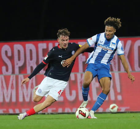 Leon Parduzi, Holstein Kiel; Oluwaseun Adewumi, Hertha BSC Berlin; Soccer, Men s, 2026–2027 Season, 2. Bundesliga, Holstein Stadium, Holstein Kiel vs. Hertha BSC Berlin, 0–0. DFL regulations prohibit any use of photographs as image sequences and or quasi-video.