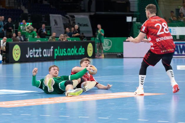 Handball, HBL2 SC DHfK Leipzig vs. ASV Hamm Westfalen, October 16, 2026; Franz Semper 32, SC DHfK Leipzig, and Adam Horvath Garaba 5, ASV Hamm Westfalen both on the floor Handball, 2nd Bundesliga, 2026–2027 season, Matchday 8: SC DHfK Leipzig vs. ASV Hamm Westfalen on October 16, 2026, at the Quarterback Immobilien Arena Leipzig Copyright: xBEAUTIFULxSPORTS JanxKaeferx