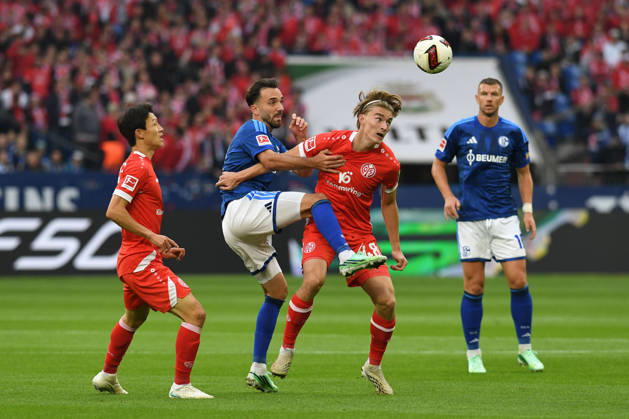 Kenan Karaman of FC Schalke 04 and Kacper Potulski of 1. FSV Mainz 05 in a tackle during the Bundesliga match between FC Schalke 04 and 1. FSV Mainz 05, Veltins Arena on October 17, 2026, in Gelsenkirchen, Germany. Photo by Ralf Treese, DeFodi Images. Kenan Karaman of FC Schalke 04 and Kacper Potulski of 1. FSV Mainz 05 battle for the ball during the Bundesliga match between FC Schalke 04 and 1. FSV Mainz 05 at Veltins Arena on October 17, 2026 in Gelsenkirchen, Germany. Photo by Ralf Treese, DeFodi Images. DFB and DFL regulations prohibit any use of photographs as image sequences and or quasi-video. Photo by Ralf Treese, DeFodi Images.