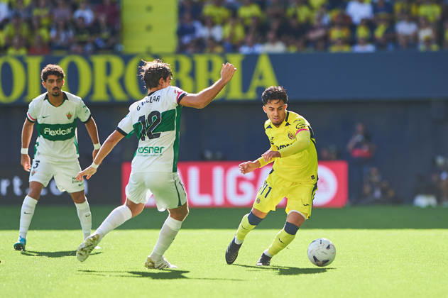 Gonzalo Villar of Elche CF and Ilias Akhomach of Villarreal CF during the LaLiga EA Sports match between Villarreal CF and Elche CF at Estadio de la Cerámica on October 17, 2026, in Villarreal, Spain