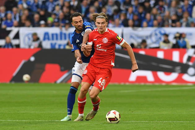 Kenan Karaman of FC Schalke 04 and Kacper Potulski of 1. FSV Mainz 05 go head-to-head during the Bundesliga match between FC Schalke 04 and 1. FSV Mainz 05, Veltins Arena on October 17, 2026, in Gelsenkirchen, Germany. Photo by Ralf Treese, DeFodi Images. Kenan Karaman of FC Schalke 04 and Kacper Potulski of 1. FSV Mainz 05 battle for the ball during the Bundesliga match between FC Schalke 04 and 1. FSV Mainz 05 at Veltins Arena on October 17, 2026 in Gelsenkirchen, Germany. Photo by Ralf Treese, DeFodi Images. DFB and DFL regulations prohibit any use of photographs as image sequences and or quasi-video. Photo by Ralf Treese, DeFodi Images.