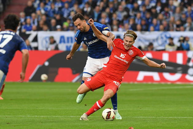 Kenan Karaman of FC Schalke 04 and Kacper Potulski of 1. FSV Mainz 05 go head-to-head during the Bundesliga match between FC Schalke 04 and 1. FSV Mainz 05, Veltins Arena on October 17, 2026, in Gelsenkirchen, Germany. Photo by Ralf Treese, DeFodi Images. Kenan Karaman of FC Schalke 04 and Kacper Potulski of 1. FSV Mainz 05 battle for the ball during the Bundesliga match between FC Schalke 04 and 1. FSV Mainz 05 at Veltins Arena on October 17, 2026 in Gelsenkirchen, Germany. Photo by Ralf Treese, DeFodi Images. DFB and DFL regulations prohibit any use of photographs as image sequences and or quasi-video. Photo by Ralf Treese, DeFodi Images.
