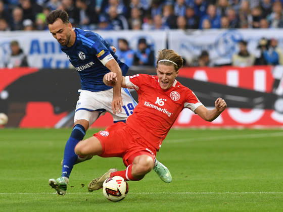 Kenan Karaman of FC Schalke 04 and Kacper Potulski of 1. FSV Mainz 05 in a tackle during the Bundesliga 1 match between FC Schalke 04 and 1. FSV Mainz 05, Veltins Arena on October 17, 2026, in Gelsenkirchen, Germany. Photo by Ralf Treese, DeFodi Images. Kenan Karaman of FC Schalke 04 and Kacper Potulski of 1. FSV Mainz 05 battle for the ball during the Bundesliga match between FC Schalke 04 and 1. FSV Mainz 05 at Veltins Arena on October 17, 2026 in Gelsenkirchen, Germany. Photo by Ralf Treese, DeFodi Images. DFB and DFL regulations prohibit any use of photographs as image sequences and or quasi-video. Photo by Ralf Treese, DeFodi Images.