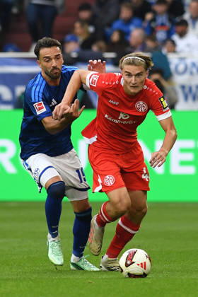 Kenan Karaman of FC Schalke 04 and Kacper Potulski of 1. FSV Mainz 05 in a tackle during the Bundesliga match between FC Schalke 04 and 1. FSV Mainz 05, Veltins Arena on October 17, 2026, in Gelsenkirchen, Germany. Photo by Ralf Treese, DeFodi Images. Kenan Karaman of FC Schalke 04 and Kacper Potulski of 1. FSV Mainz 05 battle for the ball during the Bundesliga match between FC Schalke 04 and 1. FSV Mainz 05 at Veltins Arena on October 17, 2026 in Gelsenkirchen, Germany. Photo by Ralf Treese, DeFodi Images. DFB and DFL regulations prohibit any use of photographs as image sequences and or quasi-video. Photo by Ralf Treese, DeFodi Images.