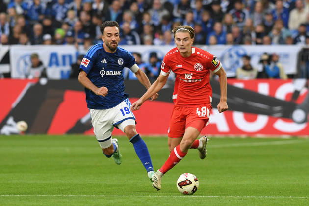 Kenan Karaman of FC Schalke 04 and Kacper Potulski of 1. FSV Mainz 05 in a tackle during the Bundesliga match between FC Schalke 04 and 1. FSV Mainz 05, Veltins Arena on October 17, 2026, in Gelsenkirchen, Germany. Photo by Ralf Treese, DeFodi Images. Kenan Karaman of FC Schalke 04 and Kacper Potulski of 1. FSV Mainz 05 battle for the ball during the Bundesliga match between FC Schalke 04 and 1. FSV Mainz 05 at Veltins Arena on October 17, 2026 in Gelsenkirchen, Germany. Photo by Ralf Treese, DeFodi Images. DFB and DFL regulations prohibit any use of photographs as image sequences and or quasi-video. Photo by Ralf Treese, DeFodi Images.