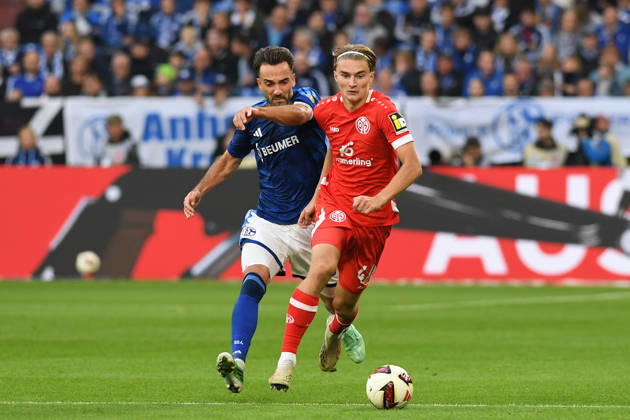 Kenan Karaman of FC Schalke 04 and Kacper Potulski of 1. FSV Mainz 05 in a tackle during the Bundesliga match between FC Schalke 04 and 1. FSV Mainz 05, Veltins Arena on October 17, 2026, in Gelsenkirchen, Germany. Photo by Ralf Treese, DeFodi Images. Kenan Karaman of FC Schalke 04 and Kacper Potulski of 1. FSV Mainz 05 battle for the ball during the Bundesliga match between FC Schalke 04 and 1. FSV Mainz 05 at Veltins Arena on October 17, 2026 in Gelsenkirchen, Germany. Photo by Ralf Treese, DeFodi Images. DFB and DFL regulations prohibit any use of photographs as image sequences and or quasi-video. Photo by Ralf Treese, DeFodi Images.