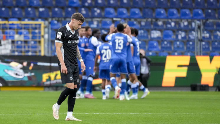SC Verl players, featuring Tim Heike Verl, 25, looking disappointed; disappointment, frustration, pessimism, after conceding the goal that made the score 1–0; action, game scene, October 18, 2026, Sinsheim, Germany, soccer, 3. Liga, TSG 1899 Hoffenheim II vs. SC Verl, DFB and DFL regulations prohibit any use of photographs as image sequences and or quasi-video xozx