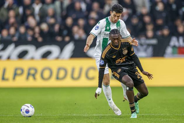GRONINGEN , 18-10-2026 , Euroborg Stadium, season 2026 2027 , Dutch Eredivisie Football , match between FC Groningen and Ajax. Picture shows FC Groningen player Pelle Clement and Ajax player Jorthy Mokio Groningen - Ajax  x208697883x Copyright: