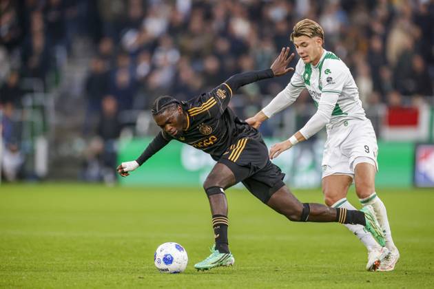 GRONINGEN , 18-10-2026 , Euroborg Stadium, season 2026 2027 , Dutch Eredivisie Football , match between FC Groningen and Ajax. Picture shows Ajax player Jorthy Mokio and FC Groningen player Brynjolfur Willumsson Groningen - Ajax  x208698527x Copyright: