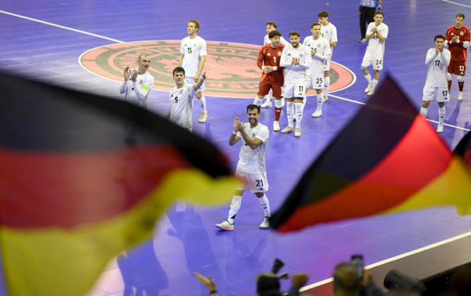 Team Germany celebrates the final goal; victory lap; from left to right: Christopher Wittig (GER), Tomas Block (GER), Matias Block (GER). Futsal World Cup qualifying match: Germany vs. Lithuania, 4–2, on October 18, 2026, in Mülheim an der Ruhr, Germany, at the Westenergie Sporthalle.