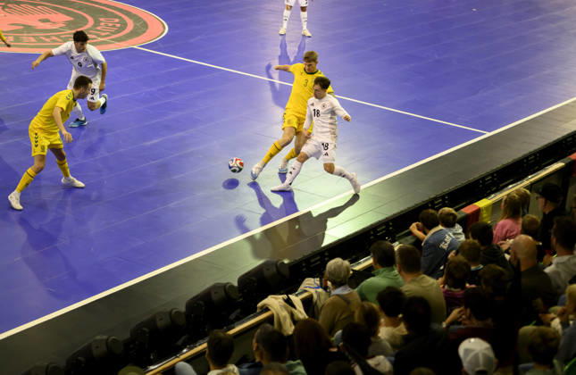 Theodoros Xydias (GER) vs. Ignas Rastutis (LIT), action, one-on-one, in front of spectators: Futsal World Cup Qualifier, Germany vs. Lithuania 4–2, on October 18, 2026, in Mülheim an der Ruhr, Germany, at the Westenergie Sporthalle