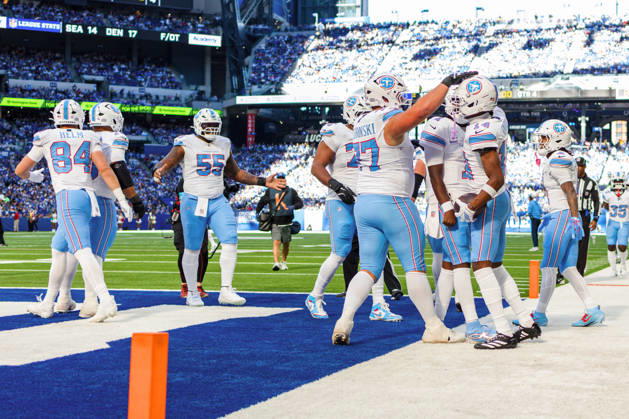 Oct 18, 2026; Indianapolis, IN, USA; Tennessee Titans wide receiver Carnell Tate (14) celebrates touchdown with his teammates during NFL, American Football Herren, USA game action against the Indianapolis Colts at Lucas Oil Stadium. Mandatory Credit: -Cal Media NFL 2026: Titans Vs Colts OCT 18  - ZUMAc04_ 20261018_zma_c04_024 Copyright: xJohnxMersitsx