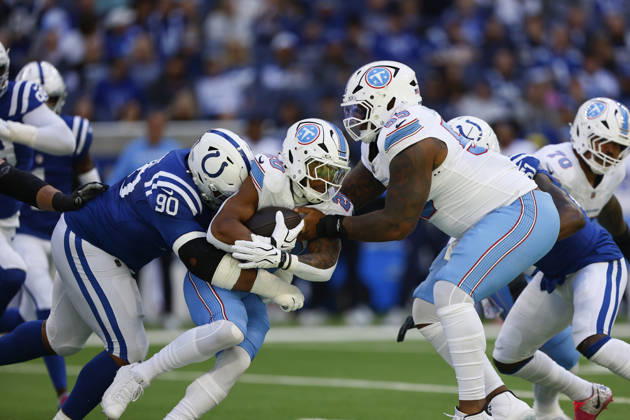 INDIANAPOLIS, IN - OCTOBER 18: Tennessee Titans running back Tony Pollard (20) is brought down by Indianapolis Colts defensive tackle Grover Stewart (90) in the first half of play during and NFL, American Football Herren, USA game between the Tennessee Titans and the Indianapolis Colts on October 18, 2026 at Lucas Oil Stadium at Indianapolis, IN. (Photo by Jeffrey Brown Icon Sportswire) NFL: OCT 18 Titans at Colts EDITORIAL USE ONLY Icon101826019