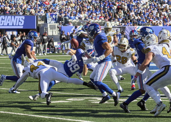 New York Giants kick returner Charlie Jones (89) fumbles after a hit by New Orleans Saints linebacker Isaiah Stalbird (44) during a NFL, American Football Herren, USA game at MetLife Stadium in East Rutherford, New Jersey. CSM East Rutherford United States - ZUMAc04_ 20261018_zma_c04_077 Copyright: xDuncanxWilliamsx