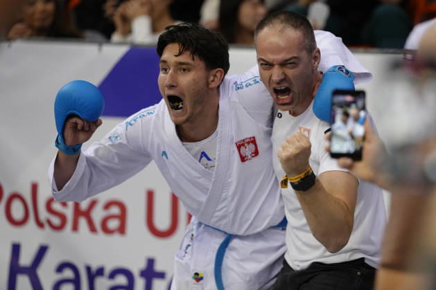 2026 World Cadet, Junior & U21, U 21 Karate Championships BIELSKO-BIALA, POLAND - OCTOBER 17: Michal Przasnyski of Poland celebrates with a coach after winning the junior male kumite +76kg bronze-medal bout at the 2026 World Cadet, Junior & U21 Karate Championships at Hala Pod Debowcem on October 17, 2026 in Bielsko-Biala, Poland. Bielsko-Biala Hala Pod Debowcem Poland Copyright: x2026xKaratexInsights PSxImagesxKjetilxWaber KaratexInsightsx