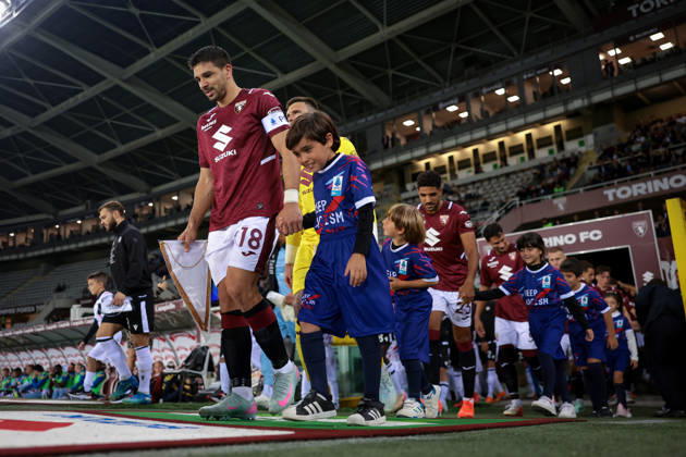 Torino FC v Udinese Calcio - Serie A - Season 2026-2027 Turin, Italy, 12th October 2026. Giovanni Simeone of Torino FC leads out team mates along with mascots prior to the Torino FC vs Udinese Calcio Serie A match at Stadio Grande Torino, Turin. Picture credit should read: Jonathan Moscrop Turin Stadio Olimpico Grande Torino Italy