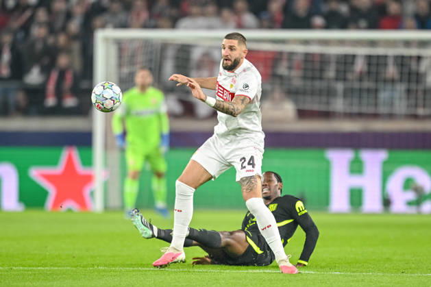 Jeff Chabot of VfB Stuttgart and Jonathan David of Atlético Madrid battle for the ball during the 2026–2027 UEFA Champions League match between Stuttgart and Atlético de Madrid at Arena Stuttgart on October 20, 2026, in Stuttgart, Germany. Photo by Harry Langer, DeFodi Images