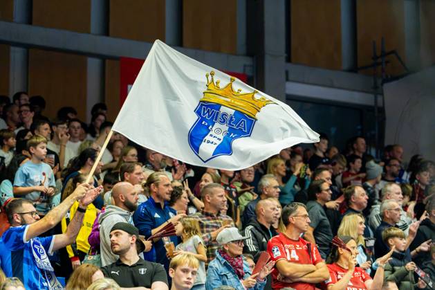 Kassel, Germany, October 22, 2026 EHF Champions League 2026–2027 Group Stage Group B Match 5 MT Melsungen vs. Orlen Wisla Plock Pictured: Fans with a flag at Rothenbach Halle in Hesse Copyright: xFotostandx xKruczynskix