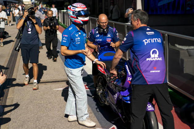 Argentine Formula One driver Franco Colapinto of Alpine F1 Team speaks to mechanics after riding a Prima Pramac Yamaha MotoGP Team bike in the paddock during the Formula One United States Grand Prix at the Circuit of the Americas in Austin, Texas on Thursday, October 22, 2026.  AUS2026102211 GREGxNASH