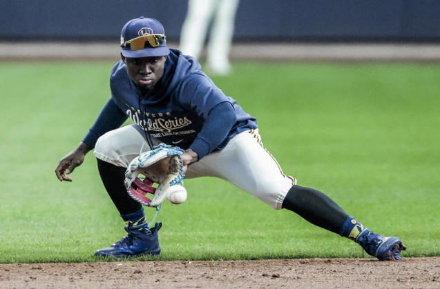 Milwaukee Brewers right fielder Luis Lara fields a ball before the start of game one of the 2026 World Series between the Tampa Bay Rays and the Milwaukee Brewers at American Family Field in Milwaukee, Wisconsin on Friday, October 23, 2026.  MIL20261023804 TANNENxMAURY