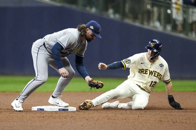 MLB, Baseball Herren, USA World Series Game 1 - Milwaukee Brewers vs Tampa Bay Rays Tampa Bay Rays second baseman Ryan Vilade (L) attempts to turn a double play during the Major League Baseball (MLB) World Series Game 1 between the Milwaukee Brewers and Tampa Bay Rays at American Family Field in Milwaukee, Wisconsin, USA, 23 October 2026. MILWAUKEE WISCONSIN UNITED STATES  Copyright: xROSSxHARRIEDx