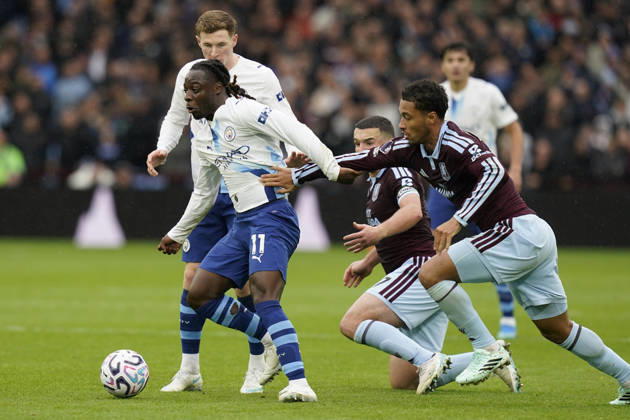 Birmingham, England, 24th October 2026. Jeremy Doku of Manchester City is challenged by Boubacar Kamara of Aston Villa during the Aston Villa vs Manchester City Premier League match at Villa Park, Birmingham. Picture credit should read: Andrew Yates Sportimage EDITORIAL USE ONLY. No use with unauthorised audio, video, data, fixture lists, club league logos or live services. Online in-match use limited to 120 images, no video emulation. No use in betting, games or single club league player publications. SPI_040_AY_Villa_Man_City SPI-5099-0040