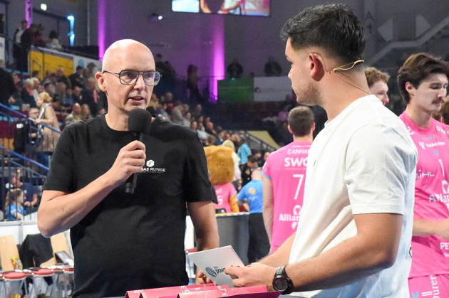 From left: Christophe Achten, Head Coach of the Powervolleys Düren; Philipp Ferebauer, arena announcer, during an interview; TV, television, microphone; October 24, 2026; Düren, Germany; volleyball; Men s Bundesliga 1; regular season; SWD Powervolleys Düren vs. WWK Volleys Munich xmhx