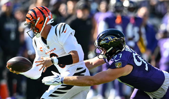 Cincinnati Bengals quarterback Joe Burrow (9) is stopped for no gain by Baltimore Ravens linebacker Ethan Burke (97) during the first quarter at M&T Bank Stadium in Baltimore, Maryland, on Sunday, October 25, 2026.  BAL20261025102 DAVIDxTULIS