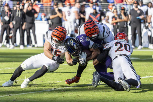 BALTIMORE, MD - OCTOBER 25: Rasheen Ali 26 of the Baltimore Ravens is stopped by Jack Kiser 45, Joe Giles-Harris 43, and Tacario Davis 20 of the Cincinnati Bengals during an NFL, American Football Herren, USA football game between the Baltimore Ravens and the Cincinnati Bengals at M&T Bank Stadium on October 25, 2026 in Baltimore, Maryland. (Photo by Ben Hsu Icon Sportswire) NFL: OCT 25 Bengals at Ravens EDITORIAL USE ONLY Icon224261025042