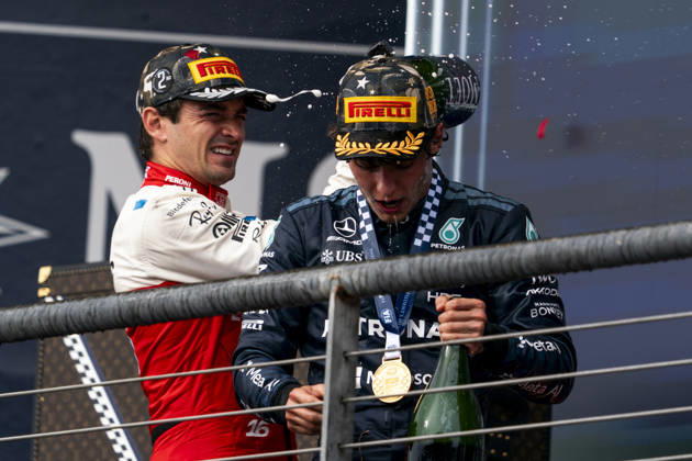 Monaco s Formula One driver Charles Leclerc of Scuderia Ferrari and Italian Formula One driver Andrea Kimi Antonelli of Mercedes-AMG Petronas spray champagne following the Formula One United States Grand Prix at the Circuit of the Americas in Austin, Texas on Sunday, October 25, 2026.  AUS2026102541 GREGxNASH